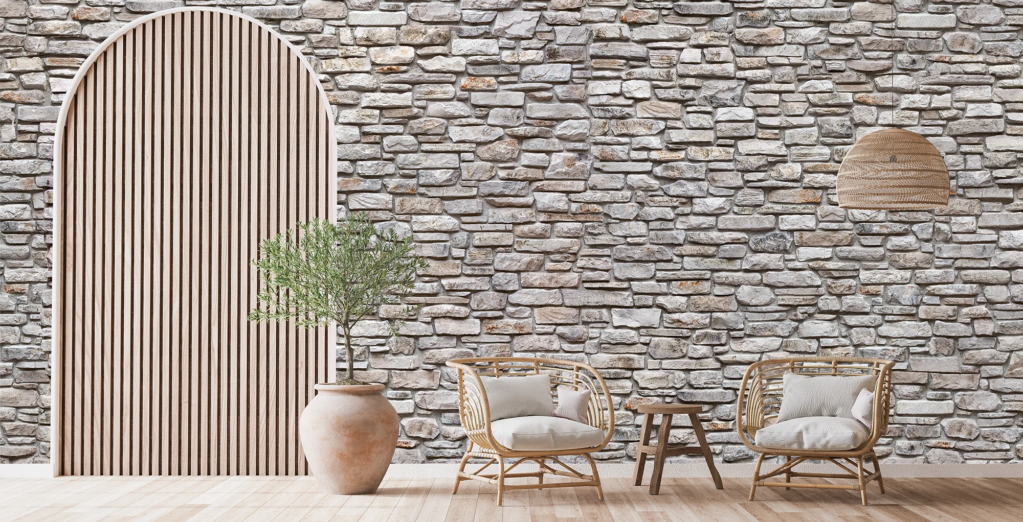 Light colored stone wall with bambu chairs